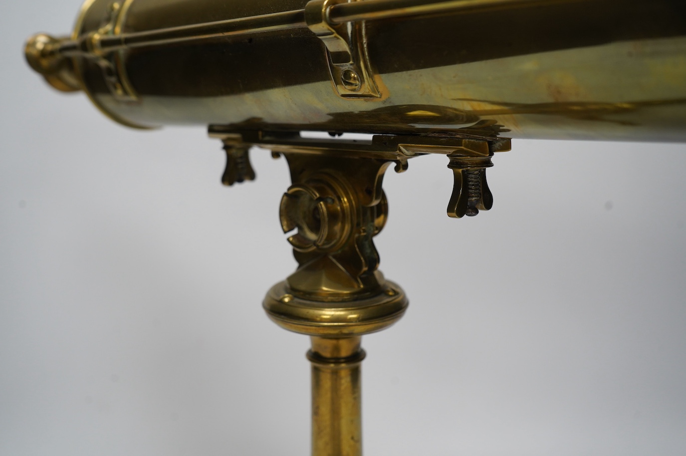 A portable brass reflector telescope on a tripod stand, engraved Ayscough, 44.5cm long. Condition - fair